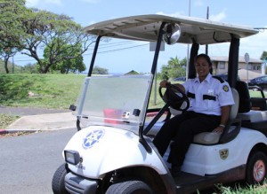 KCC security guard Hiʻilani Moses on her front gate watch