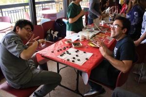 Hunter Kay (right) playing Xiang Qi (Chinese Chess) with another student.