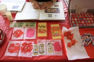 Chinese money, Chinese paper cuts, New Year gift packages, and Chinese candy.