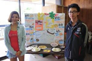 Chinese booth, run by exchange students Nicole Hu and Christopher Lam, teaching students how to order and pronounce certain Chinese foods.