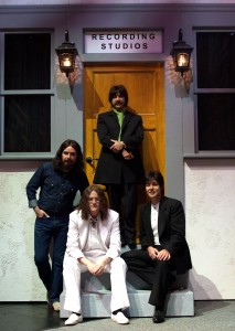 (L-R) Ralph Castelli, Steve Landes, Ralph Castelli, and Joey Curatolo in "Abbey Road" attire perform in "Rain : A Tribute to the Beatles."
