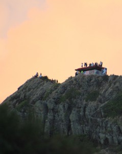 Patriotic youth make it to the Pill Boxes that overlook Lanikai Beach in Kailua to start their Independence Day before the sun.