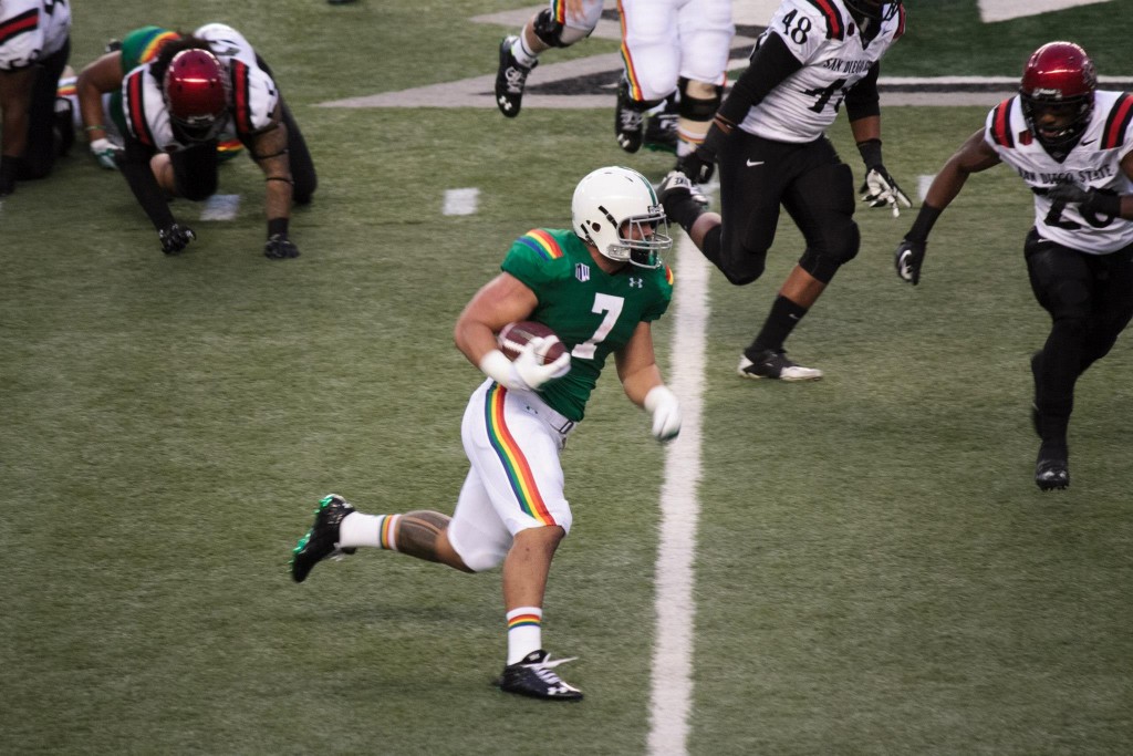 UH running back Joey Iosefa attempts to get a first down against the San Diego State Aztecs. Photo: Devin Takahashi/ Kapiʻo.