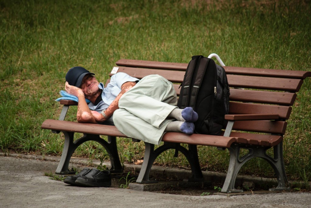 A man takes a rest on a park bench in small in Chiyoda-ku, Tokyo. Photo: Devin Takahashi/Kapi'o.